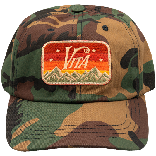 Front, camo trucker hat with Vita patch. No Background