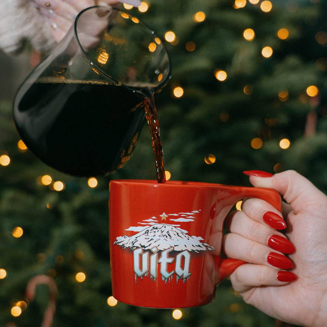 Holiday Mountain Mug - coffee pouring into the mug in front of a Christmas tree